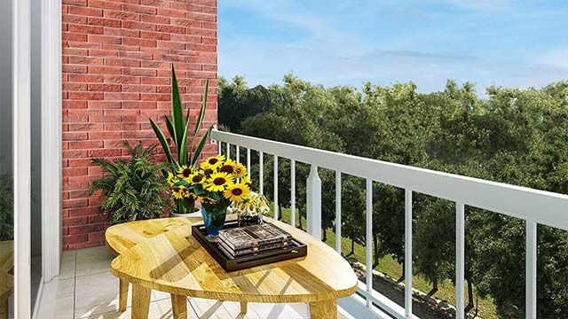 Small yellow table with flowers set on the private balcony at Park Place One Apartments