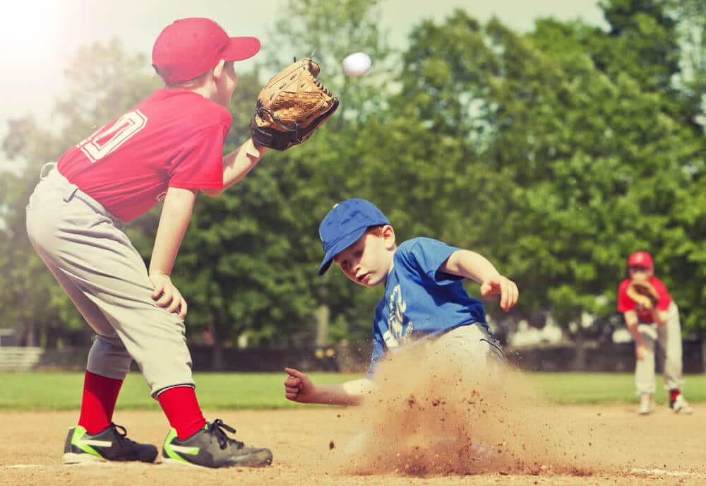 10 ORGANIZED YOUTH SPORT OPTIONS IN NORTHEAST PHILADELPHIA | boy sliding into home plate | www.phillyaptrentals.com 