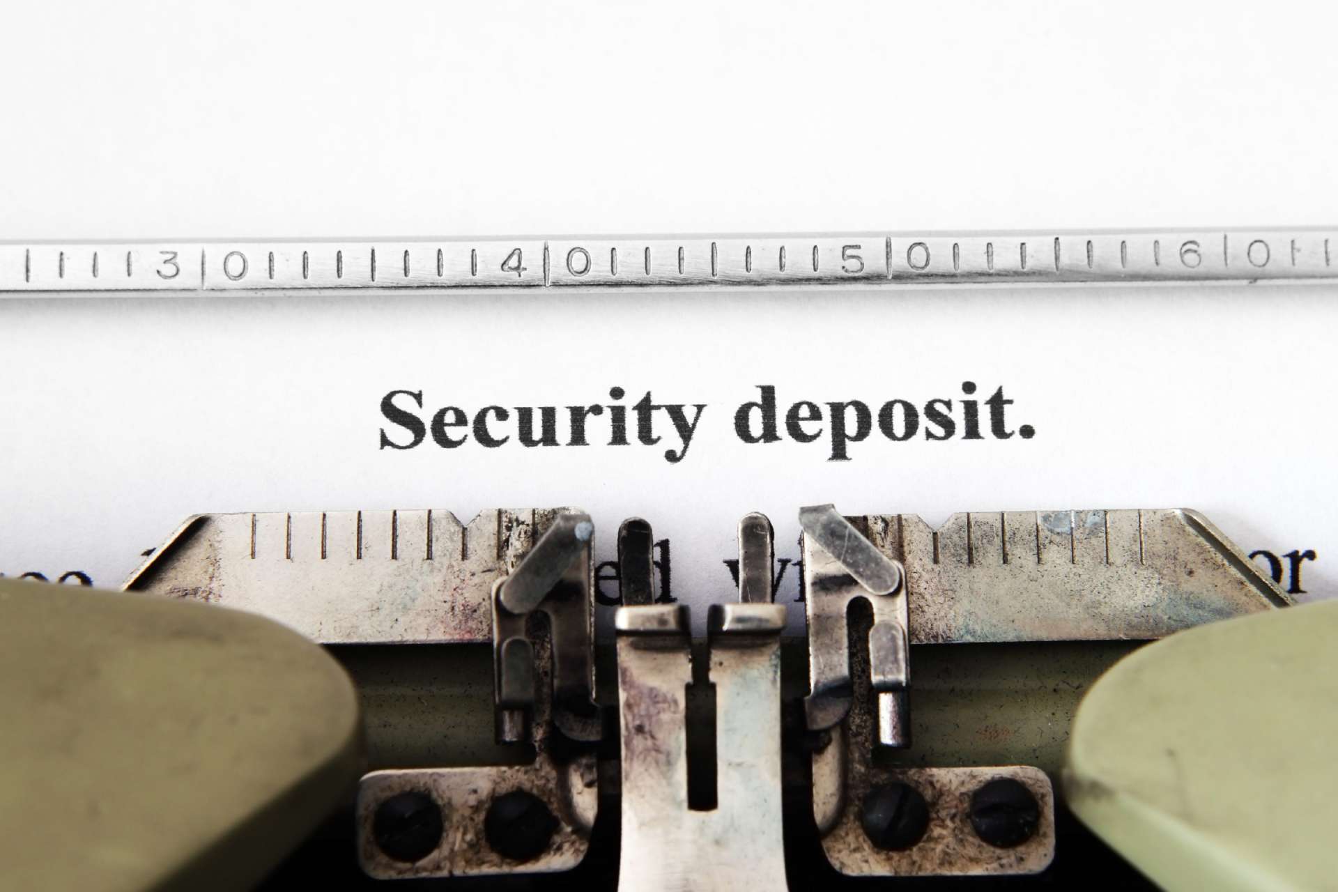 Typewriter with words "security Deposit"