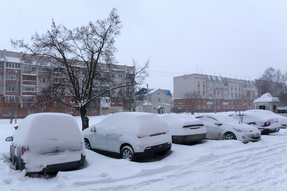 What is an Apartment Surface Parking Lot | Car Parked Outside in Snow | www.phillyaptrentals.com 