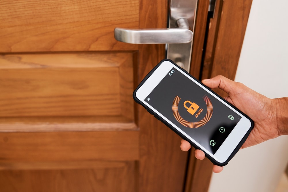 An Apartment Smart Lock being armed | phillyaptrentals.com