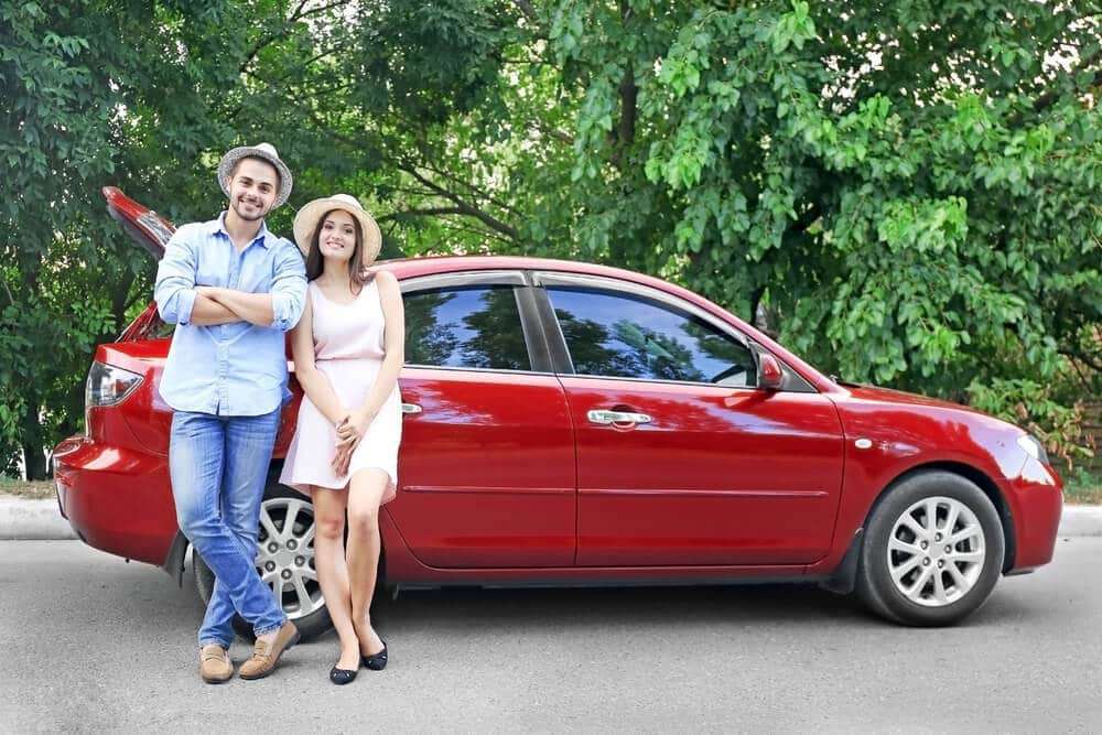 20 Daytrips From Philadelphia | Couple Standing Outside Car | www.phillyaptrentals.com