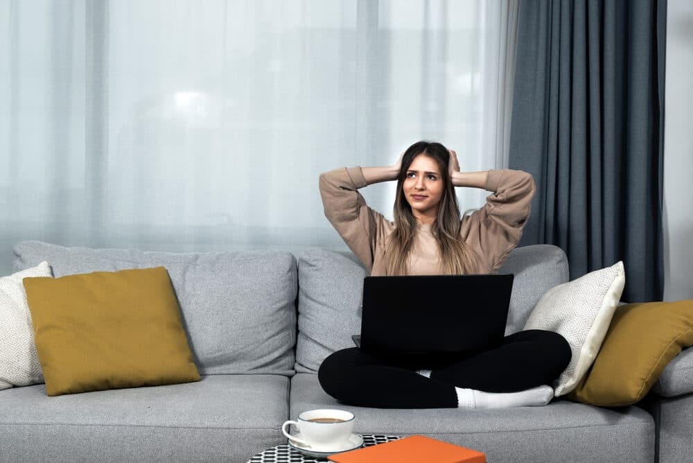 Woman In Apartment Covering Ears to Mask Noise Below| www.phillyaptrentals.com