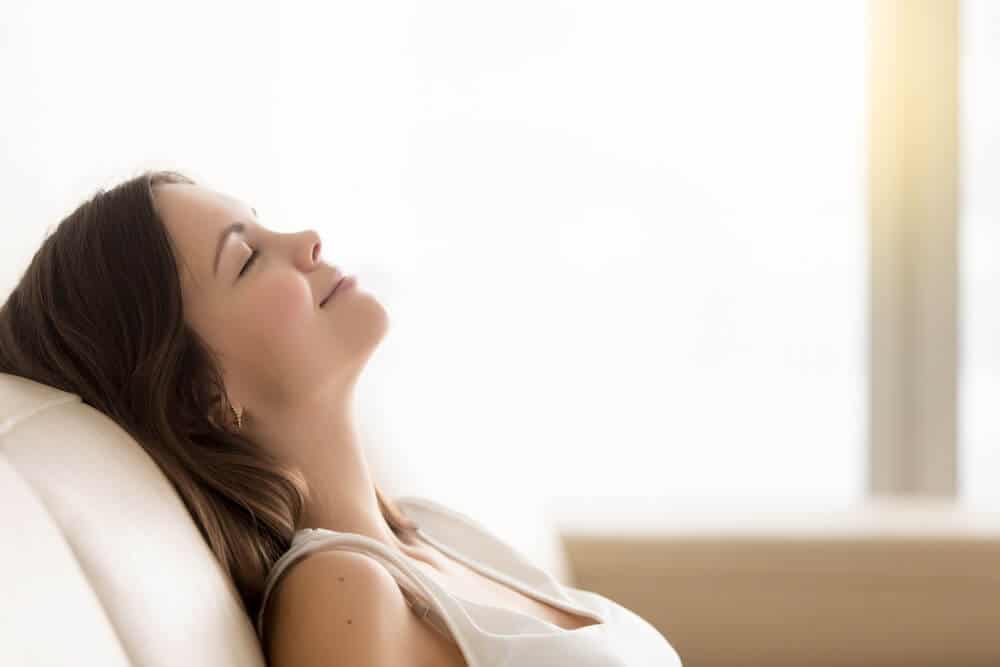 What Time Should Be Quiet Time in an Apartment | Woman Relaxing at End of Day | www.phillyaptrentals.com