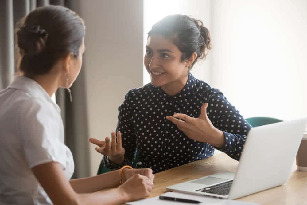 Can I Refer a Friend | Two Women Friends Talking | www.phillyaptrentals.com