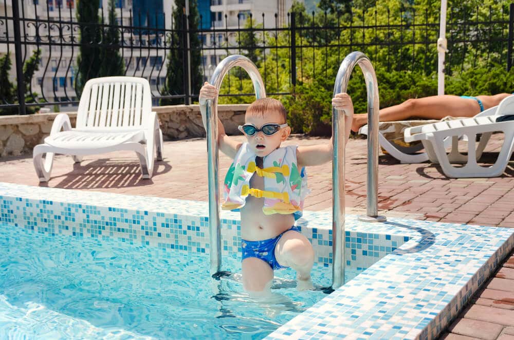 Swimming Pool Etiquette | Child on Pool Steps | www.phillyaptrentals.com 